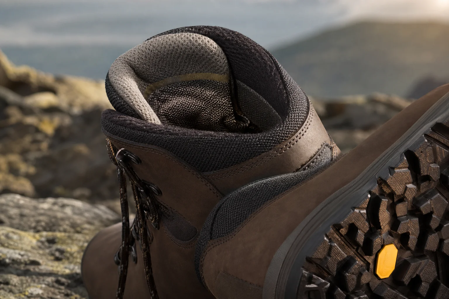 Close-up of hiking boot with gortex lining on rocky terrain