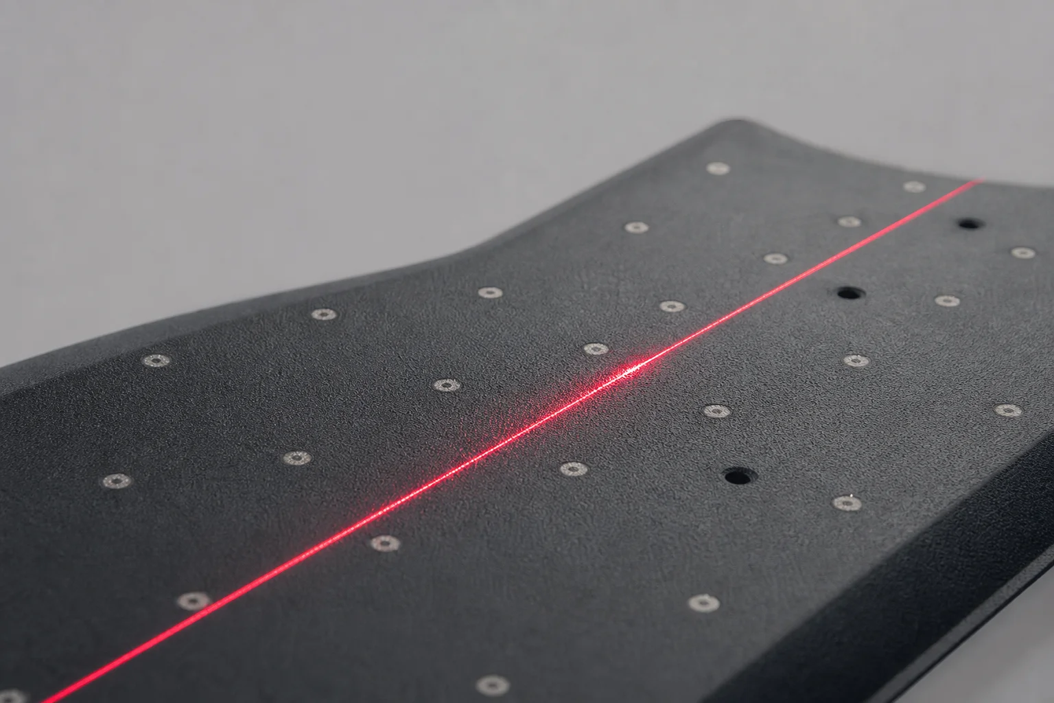 Close-up of laser scanner projection pattern on black surface