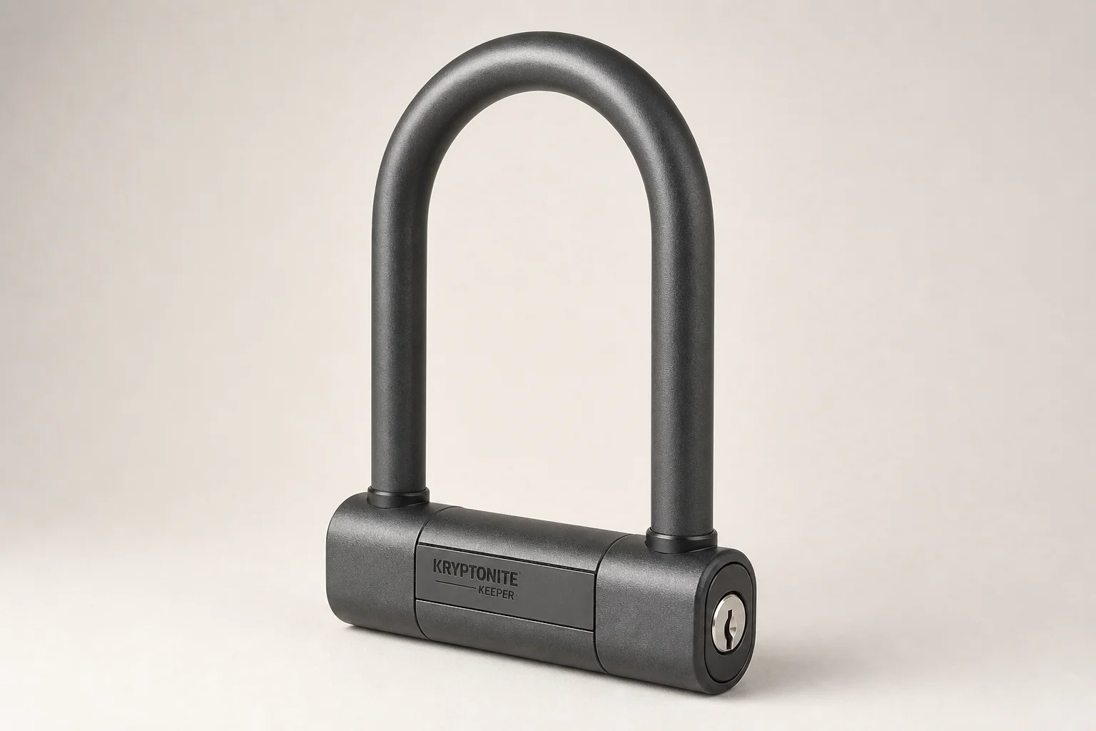 Three Abus bike locks arranged on neutral backdrop: folding lock, U-lock, and heavy-duty lock