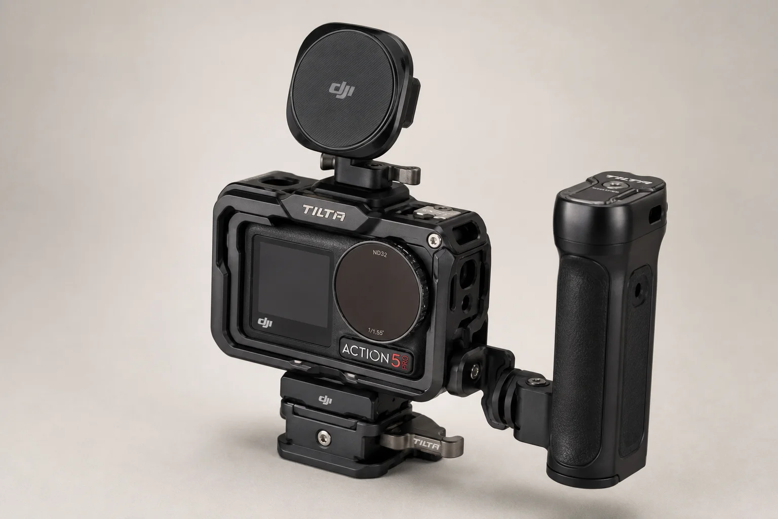 DJI Action 5 Pro in Tilta metal cage with side handle, phone mount, and ND filter