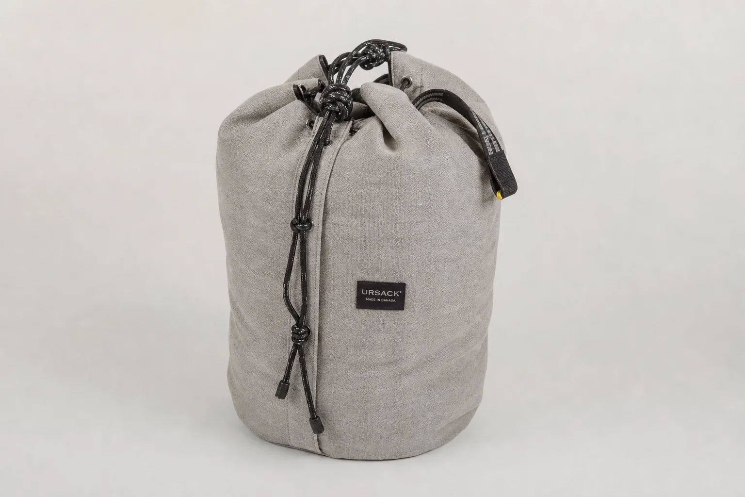 Seven food storage solutions for backpacking arranged on neutral backdrop
