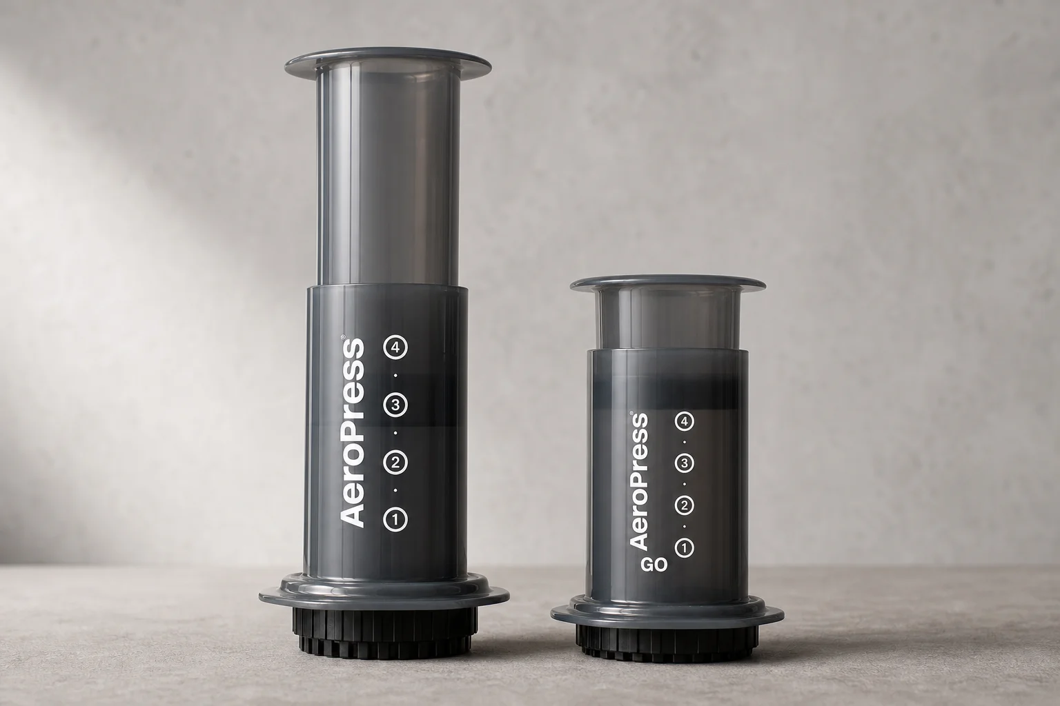 Side-by-side comparison of original Aeropress and Aeropress Go heights