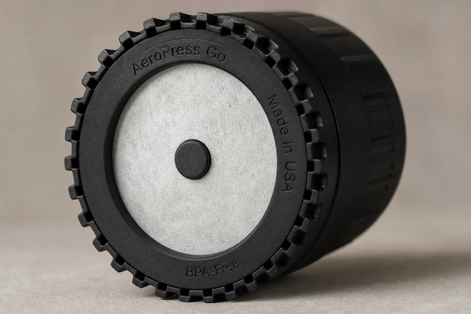 Close-up of Aeropress Go filter basket showing the blanked center hole