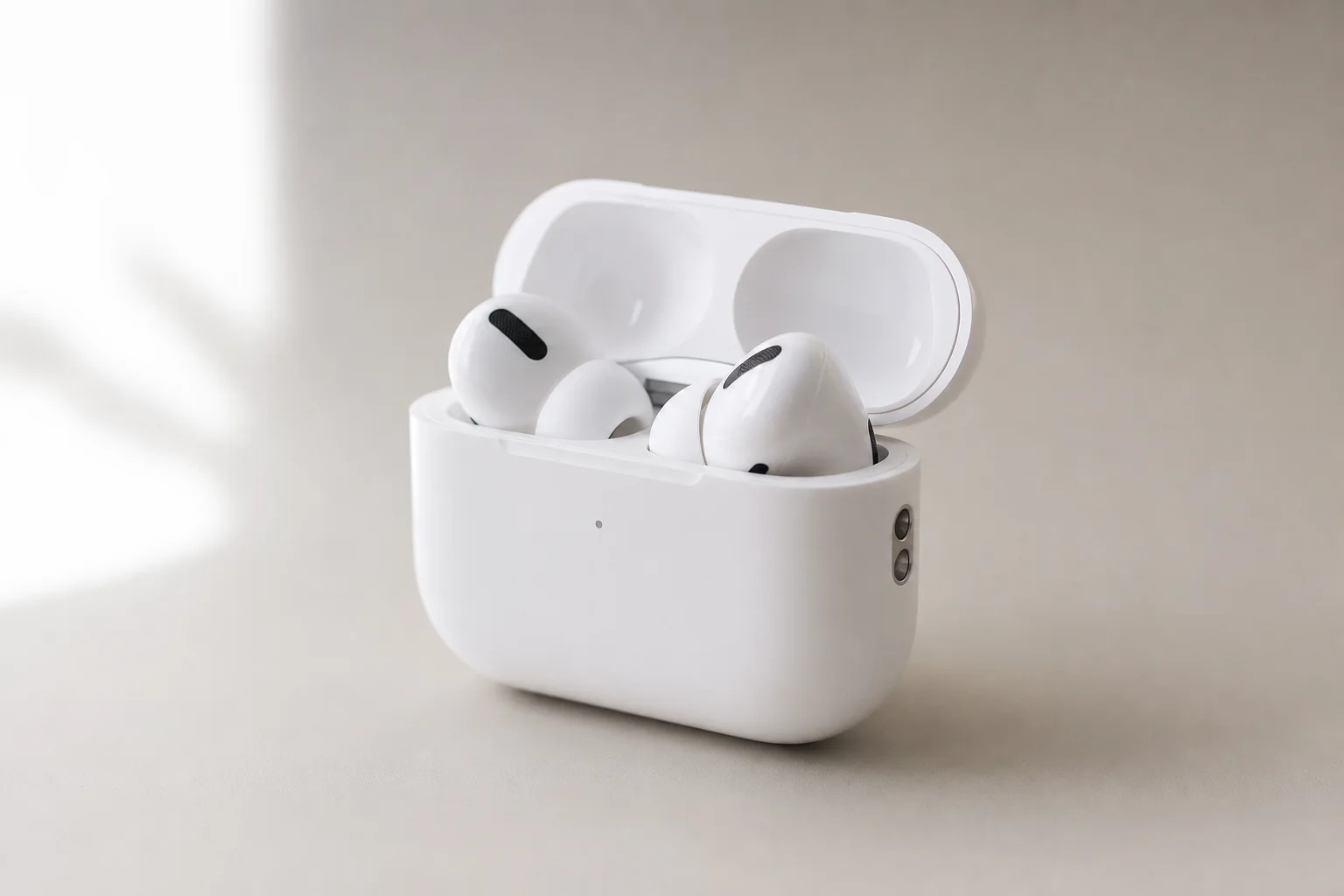 Nine earbud models arranged by price tier on concrete surface