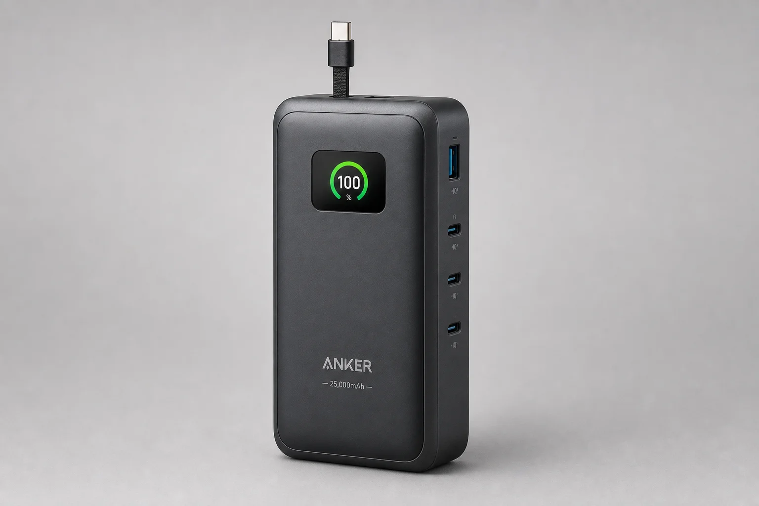 Anker 25,000mAh and 27,000mAh power banks side by side on concrete