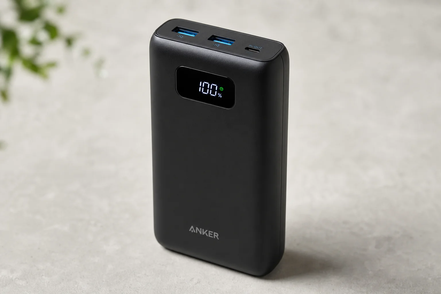 Six Anker power banks arranged on concrete surface showing size and design differences