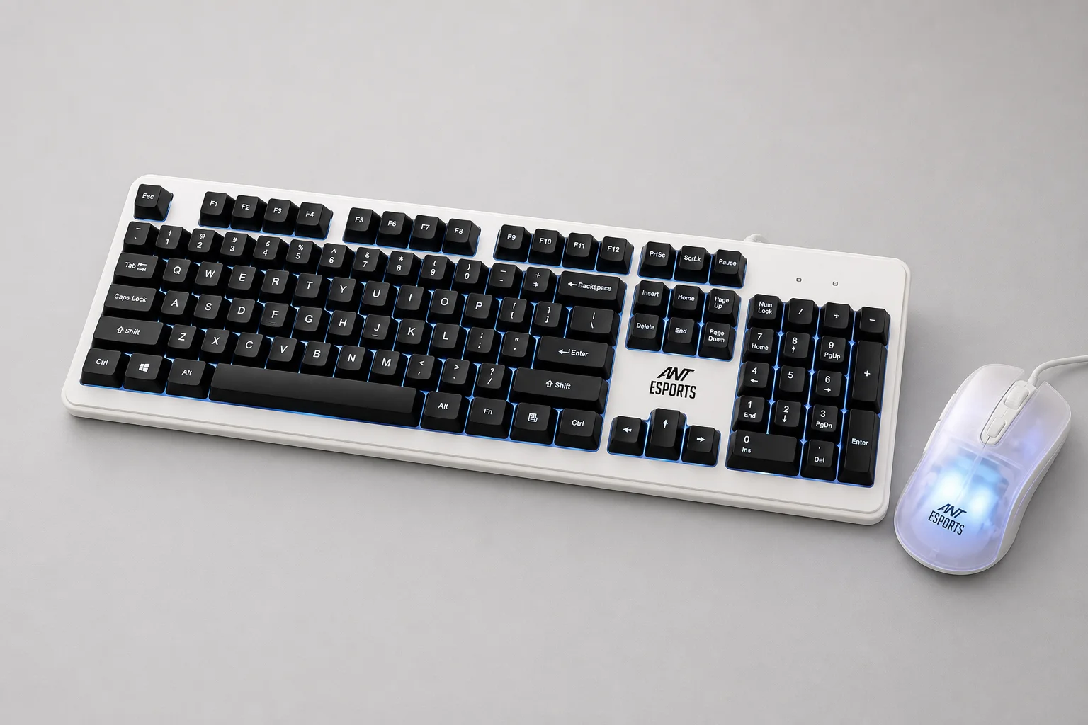 Eight gaming keyboard-mouse combos displayed on concrete surface showing various designs and colors