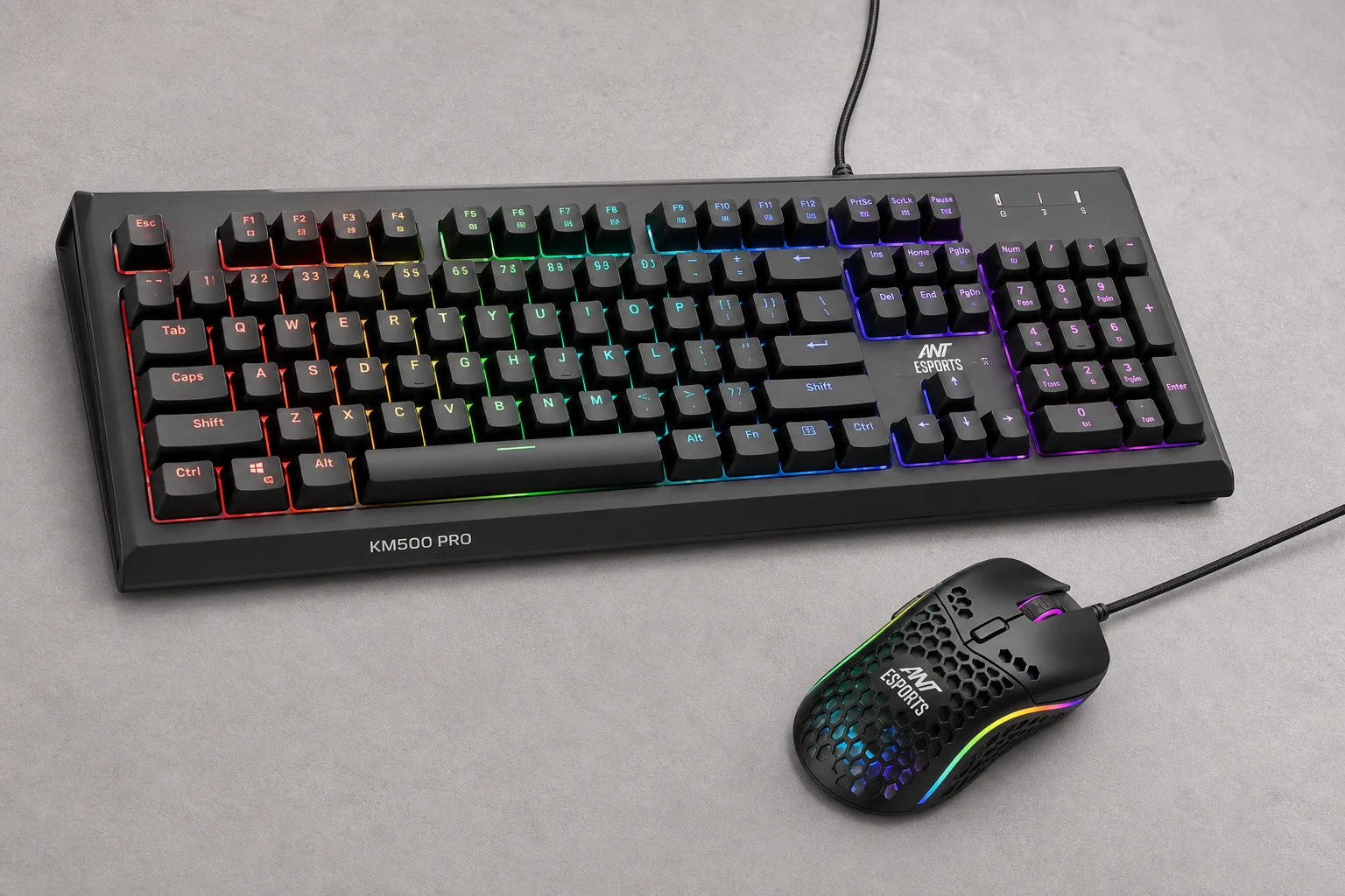 Eight gaming keyboard-mouse combos displayed on concrete surface showing various designs and colors