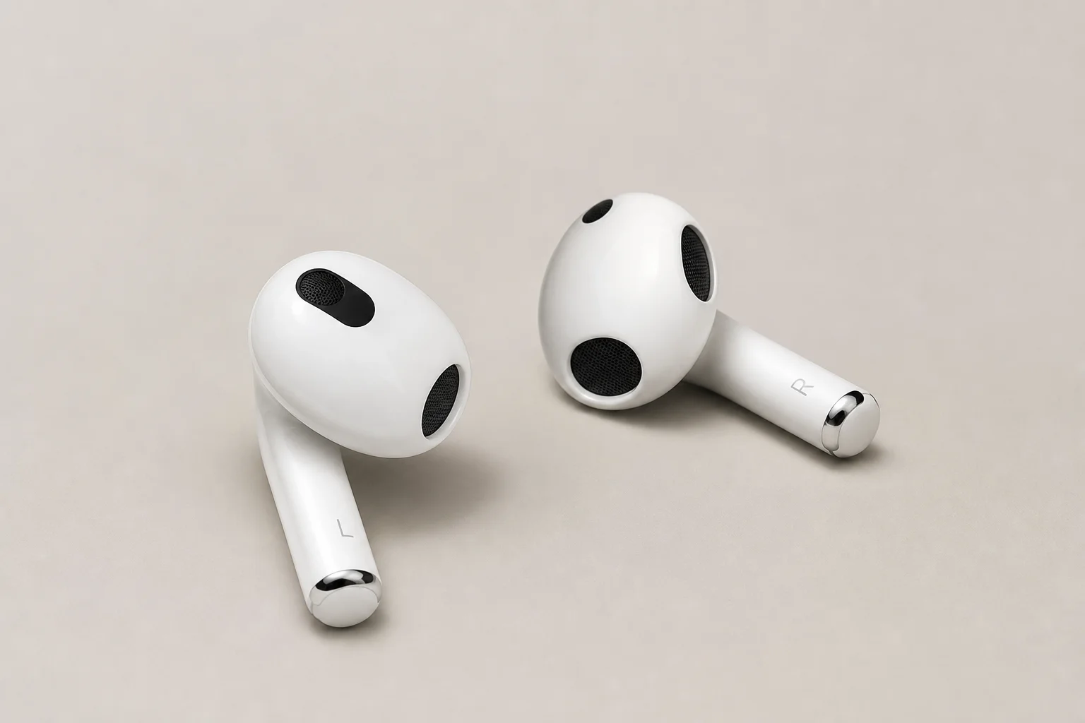 Collection of 12 true wireless earbuds arranged on concrete surface