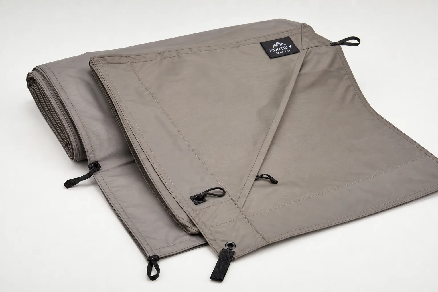 Seven survival tents of varying sizes and styles arranged on neutral backdrop