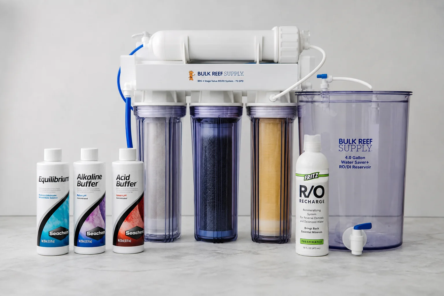 Aquarium RO/DI water treatment system with remineralization product bottles on neutral surface