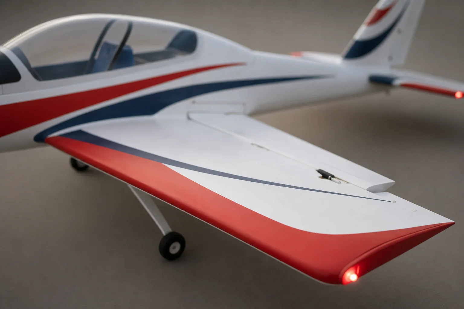 Close-up of RC aircraft control surfaces and navigation lights