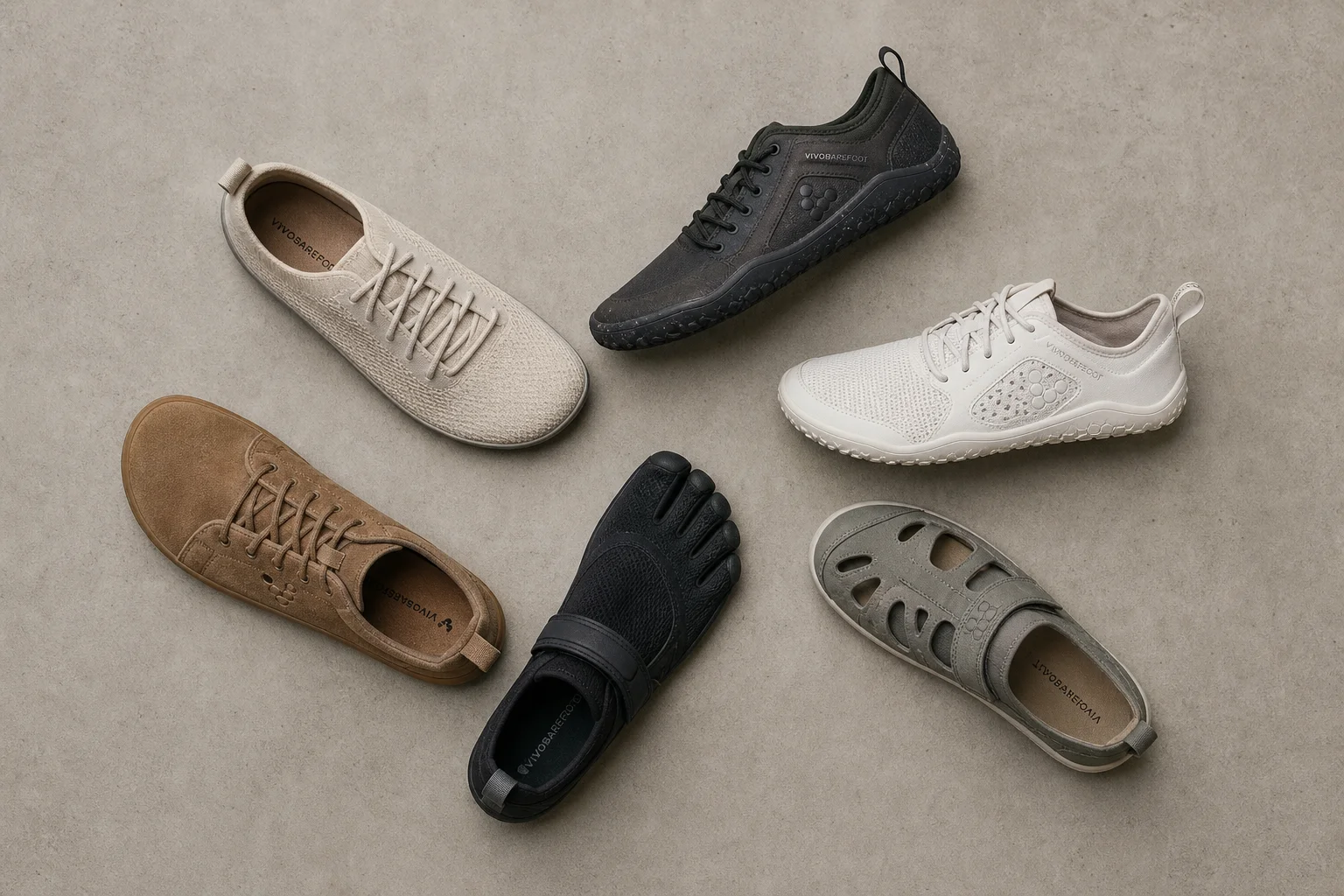 Overhead flat-lay of barefoot shoes in various colors and styles on concrete