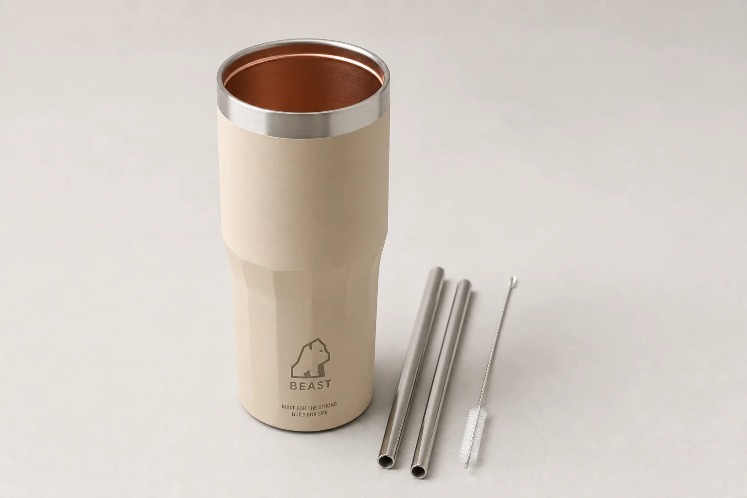 Collection of ten insulated bottles and travel mugs displayed on concrete surface