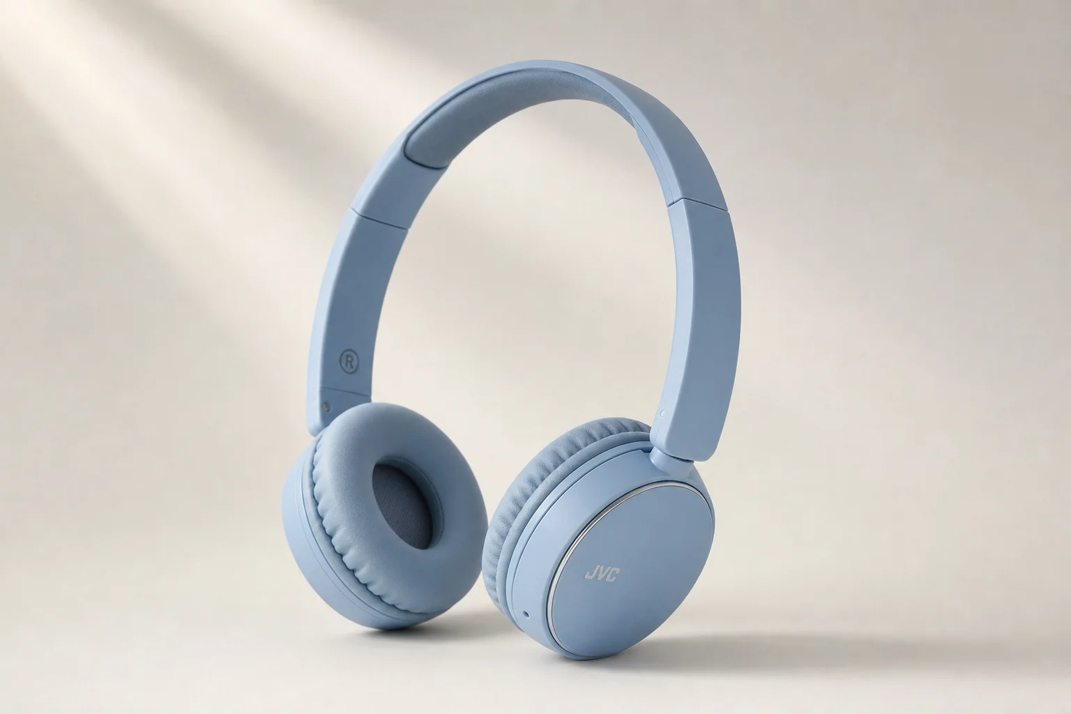Beats Studio Pro and Beats Solo 4 headphones displayed on concrete surface