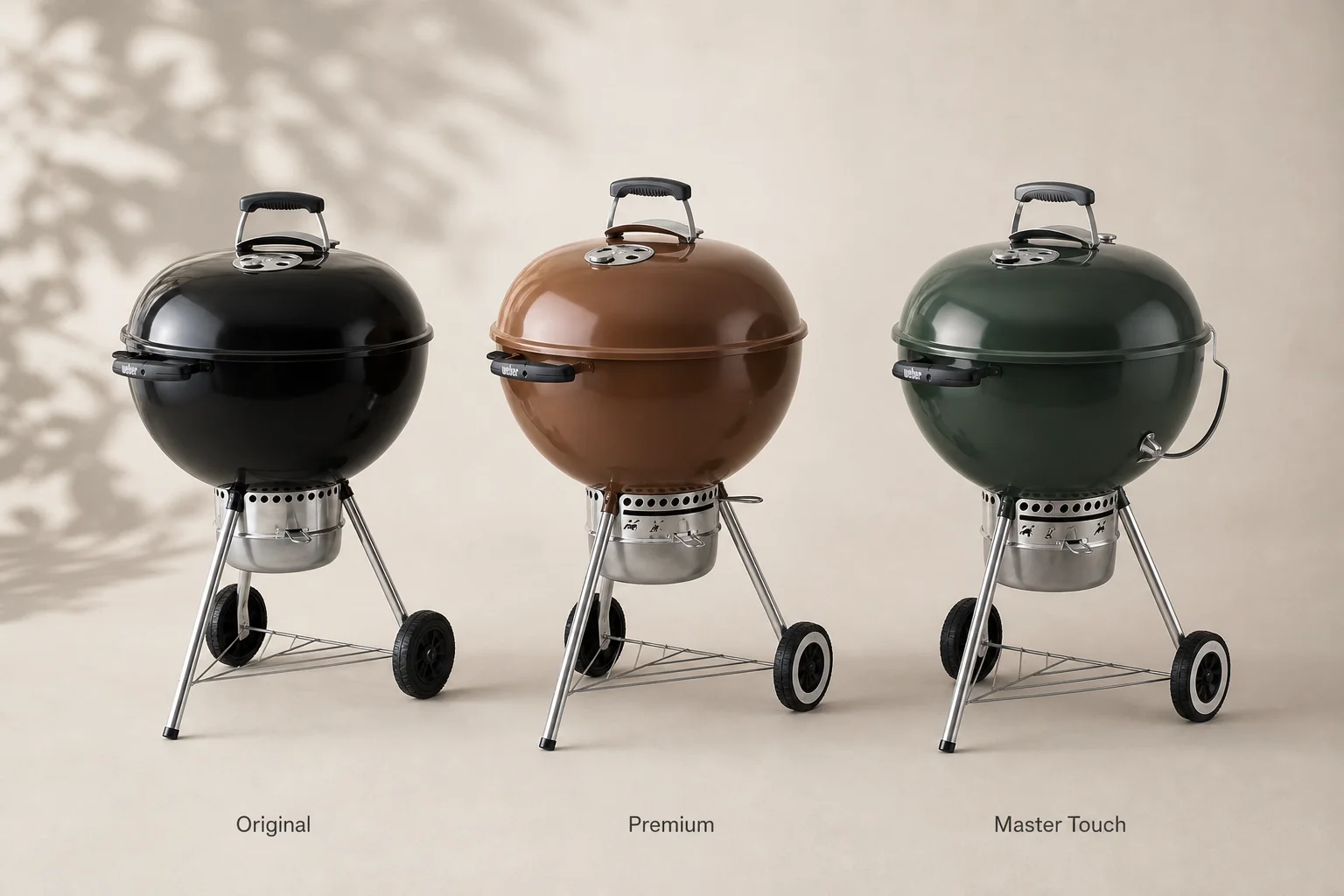 Three Weber 22-inch kettle grills lined up showing Original, Premium, and Master Touch models