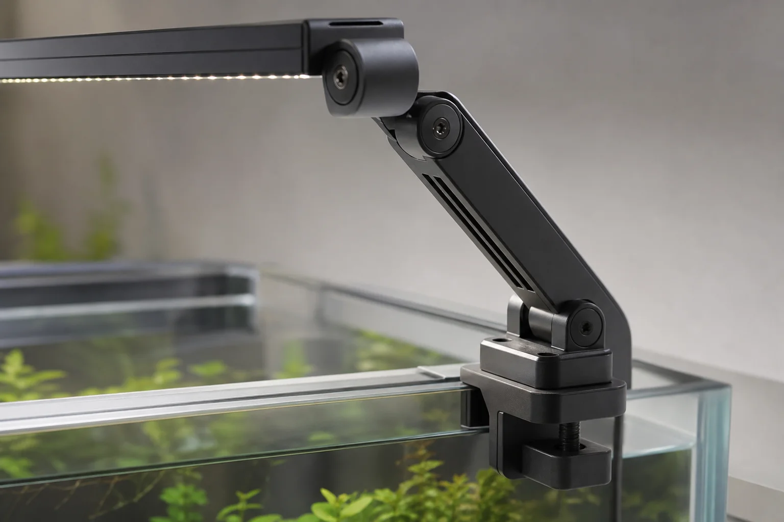 Close-up of adjustable LED light arms and mounting hardware on aquarium rim