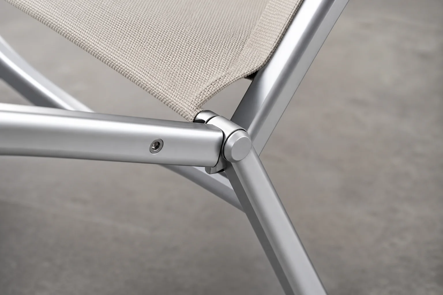 Close-up detail of chair leg design showing aluminum frame construction