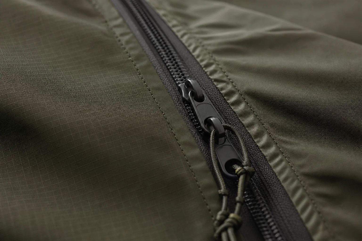 Close-up of bivvy bag zipper and weather-resistant fabric detail