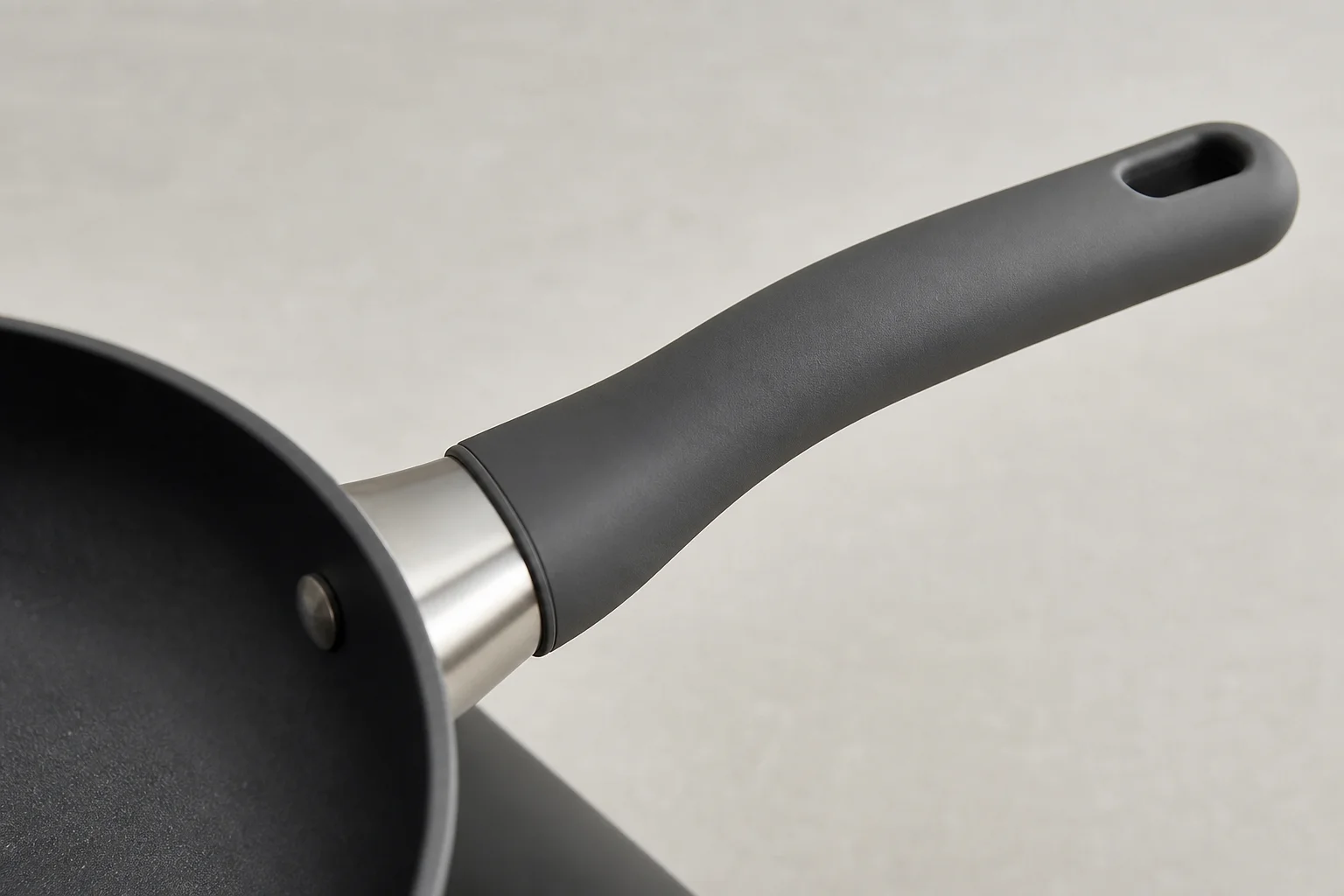 Non-stick pan handle detail showing ergonomic grip design