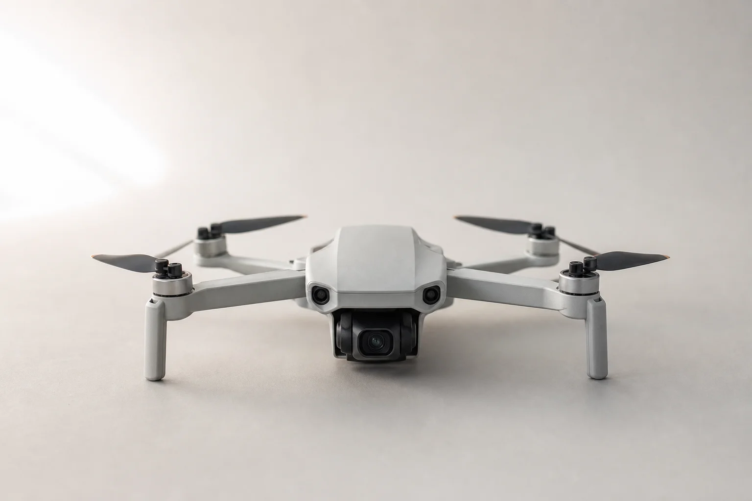 Foldable drone in open position on neutral surface ready for flight