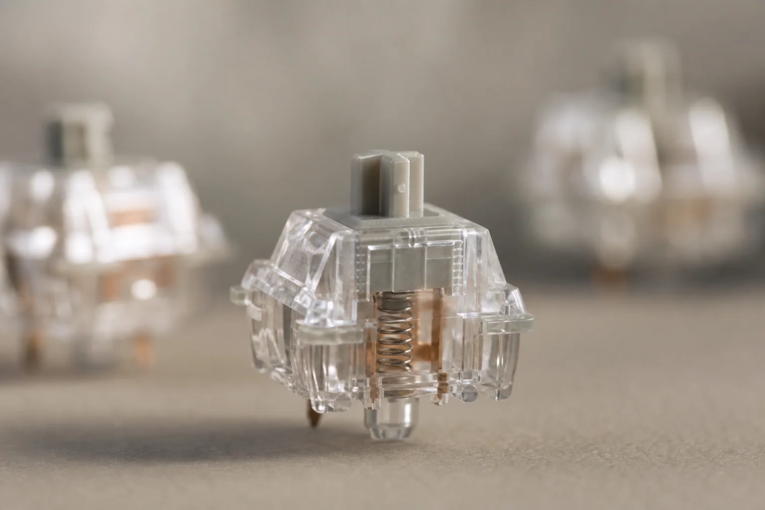 Close-up of mechanical keyboard switches showing internal stem and spring details