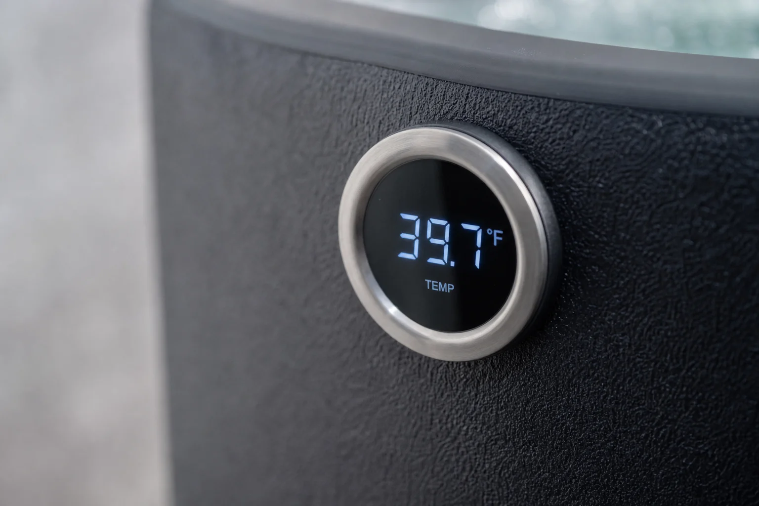 Close-up of a digital thermometer display on a cold plunge tub