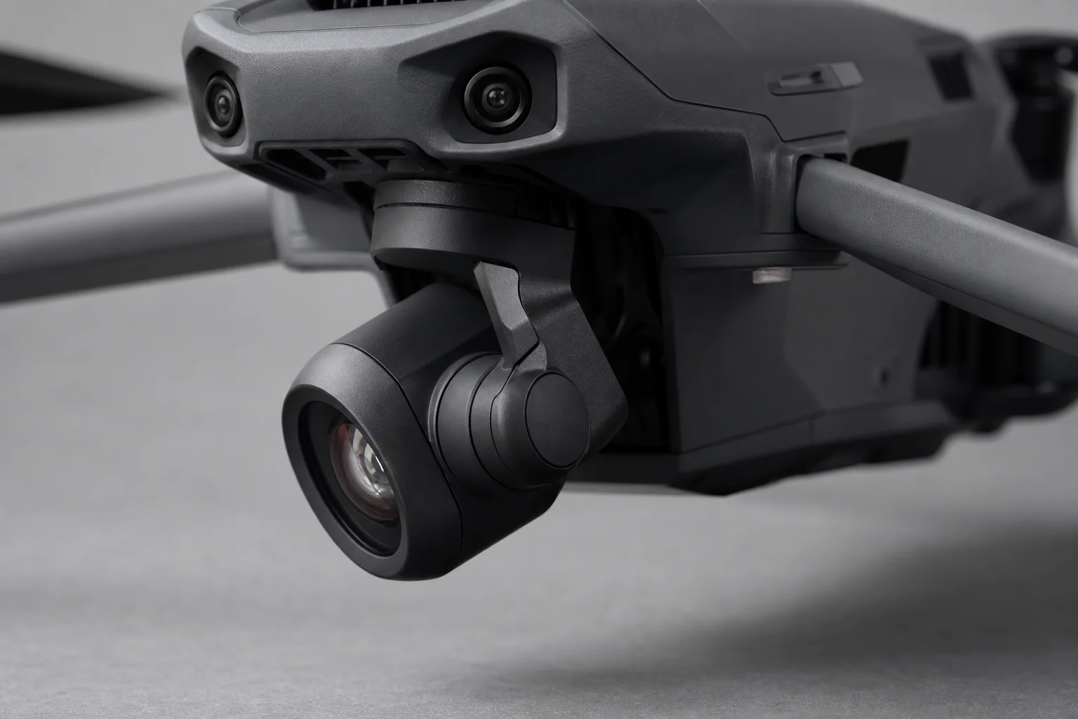 Drone camera gimbal tilting downward showing mechanical detail