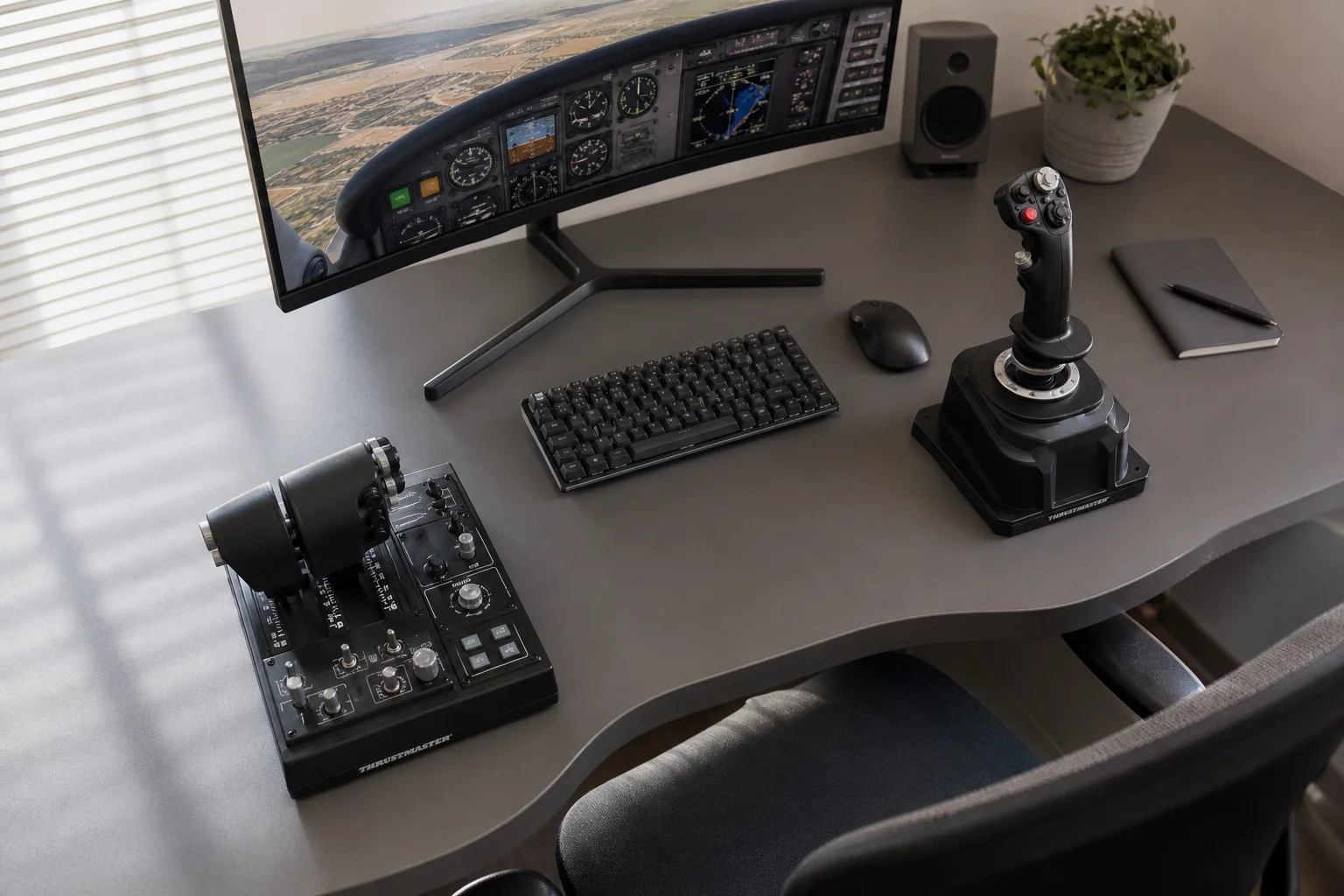 Flight sim setup with joystick and throttle on desk