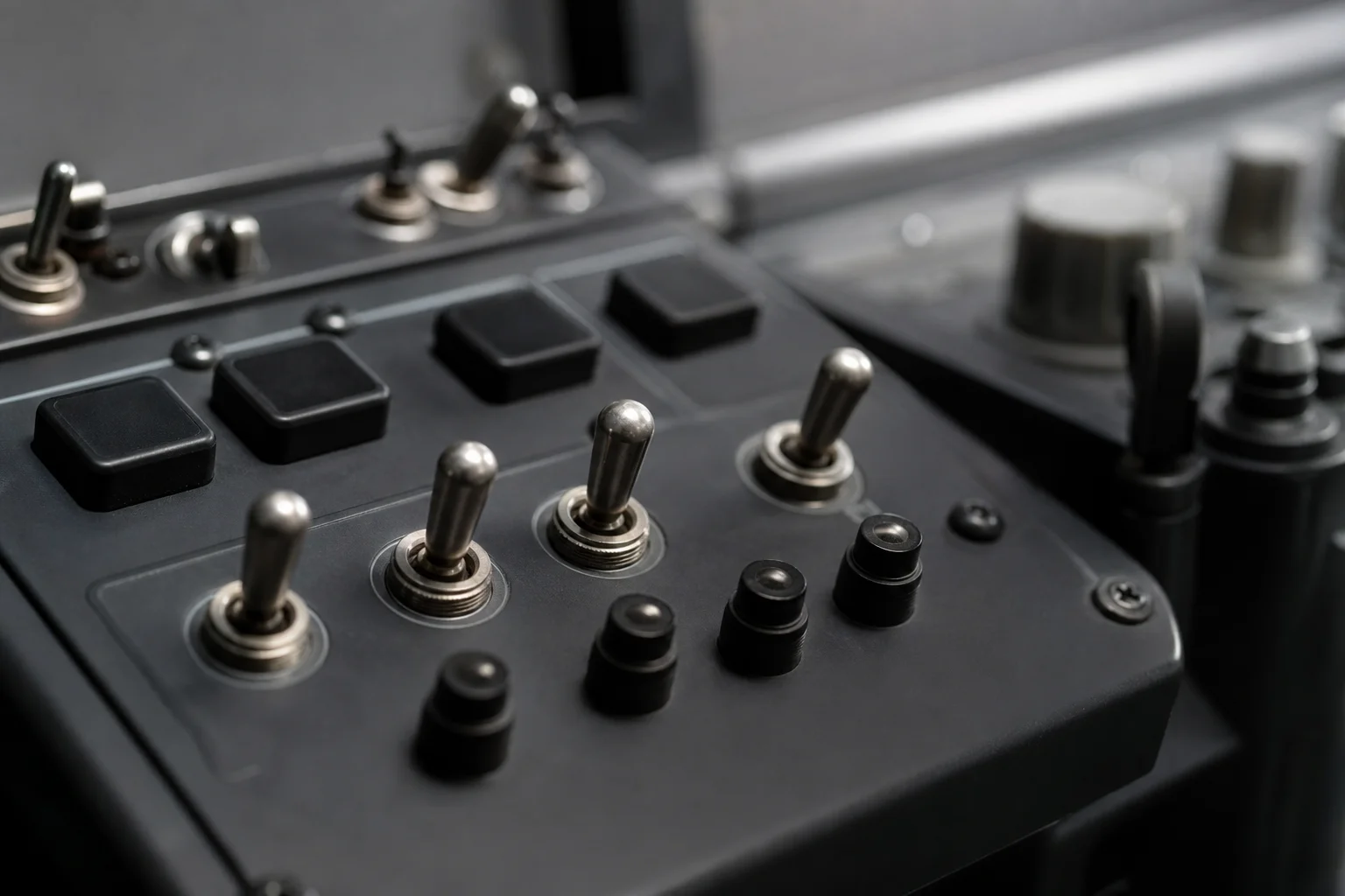 Close-up of mechanical switches and buttons on flight panel