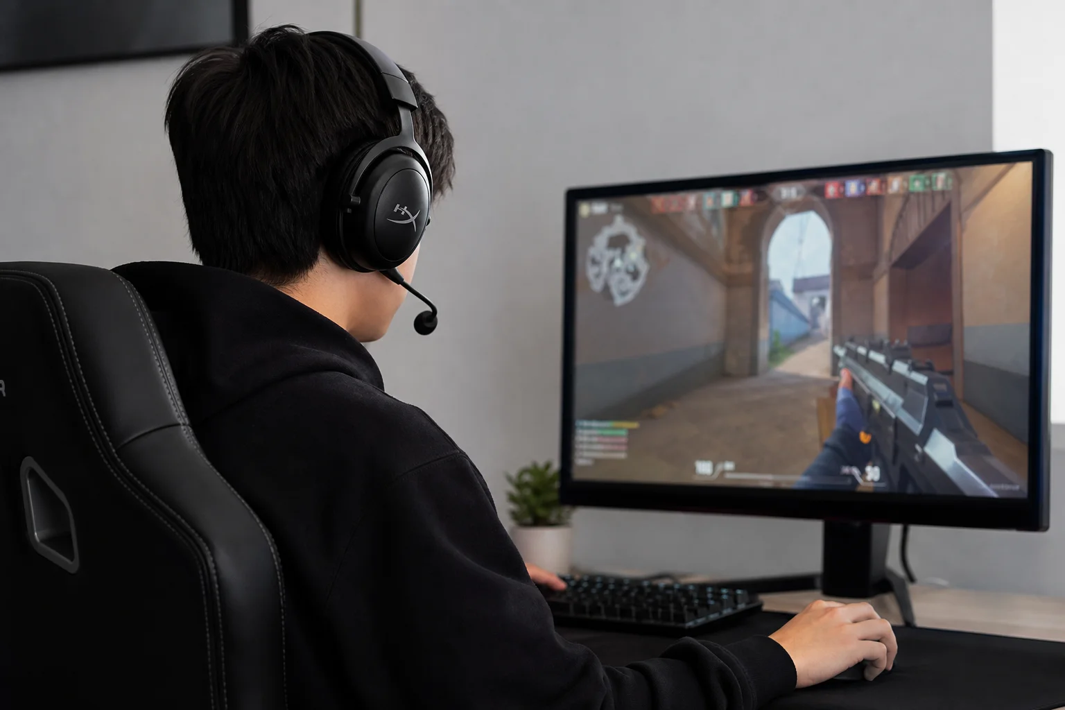 Gamer in profile wearing headset during active gameplay session