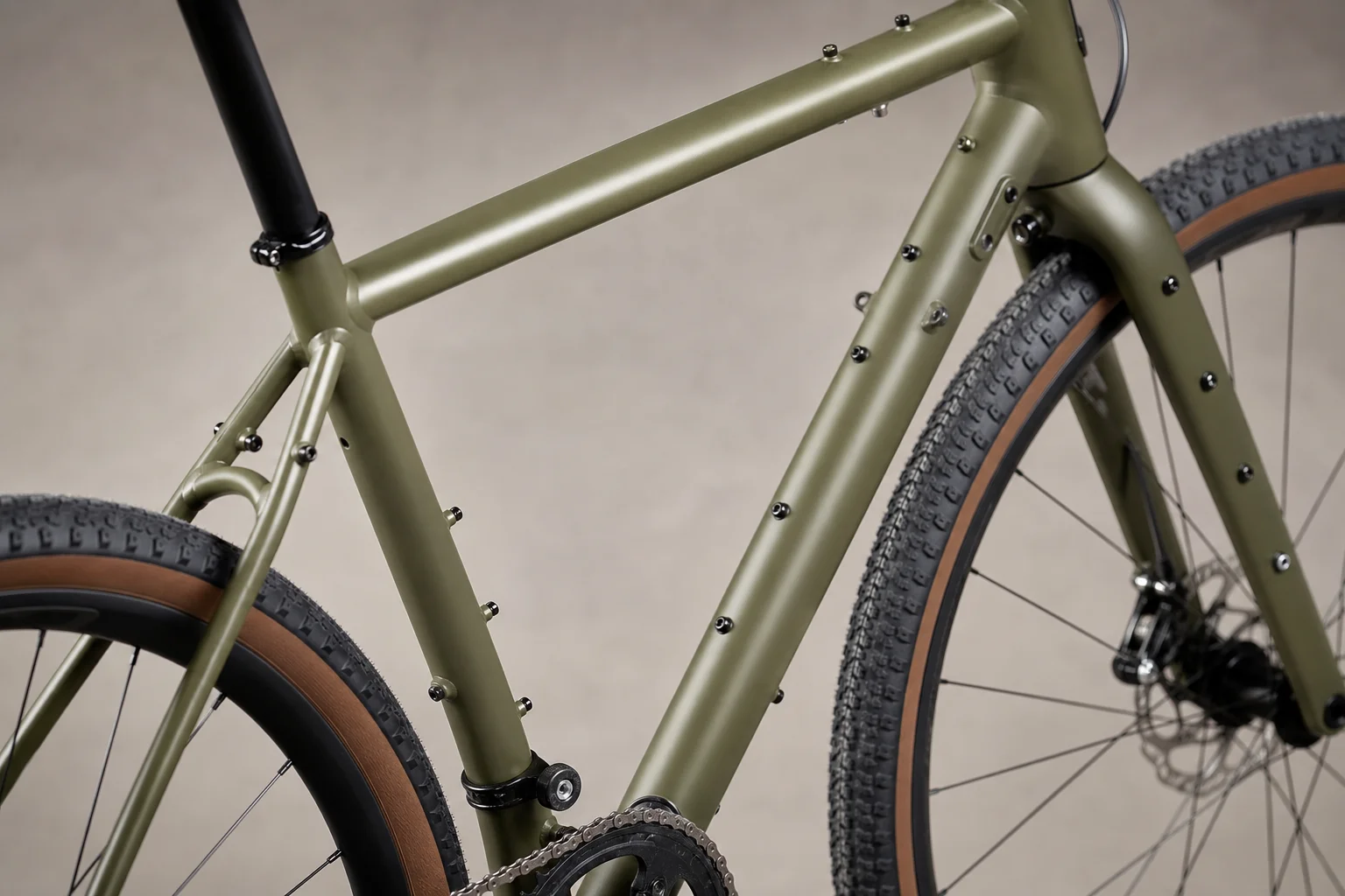 Gravel bike frame showing multiple mounting points for racks, bags, and fenders