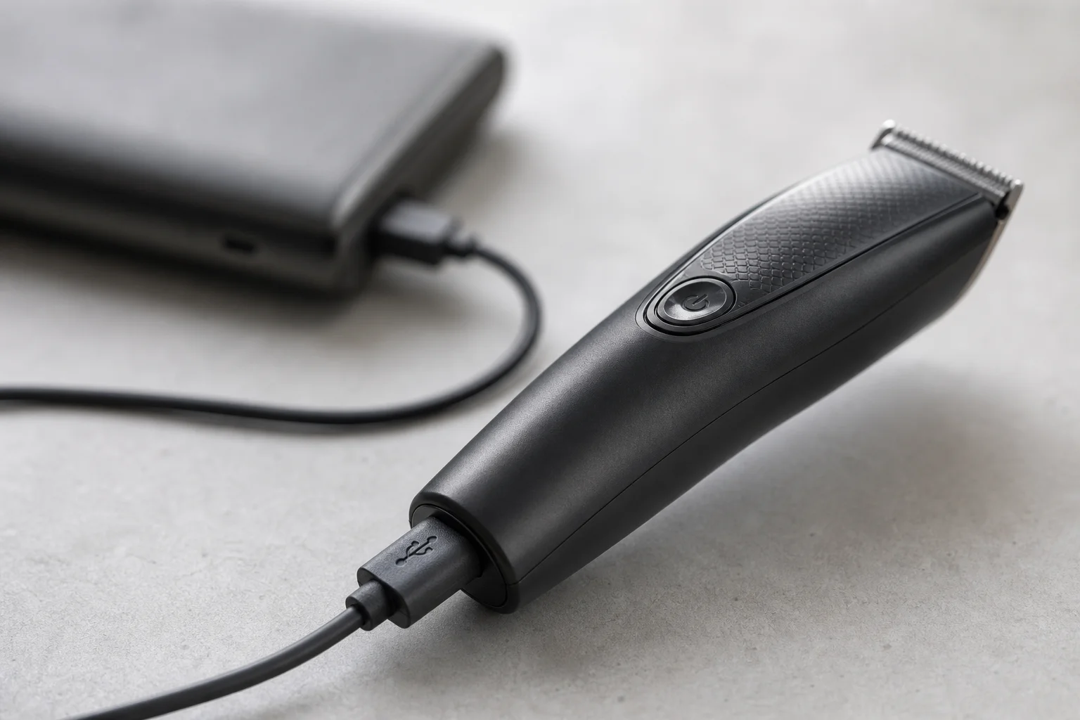 USB charging cable connected to a trimmer, showing modern charging convenience