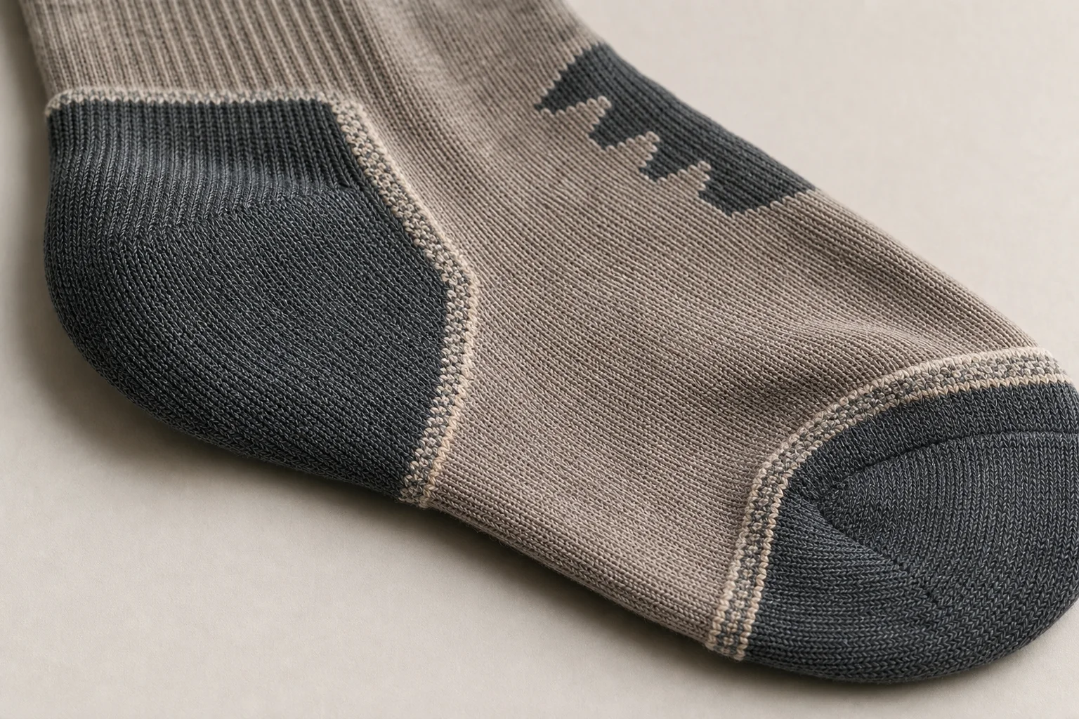 Close-up detail of hiking sock seams and construction showing flat-seam design