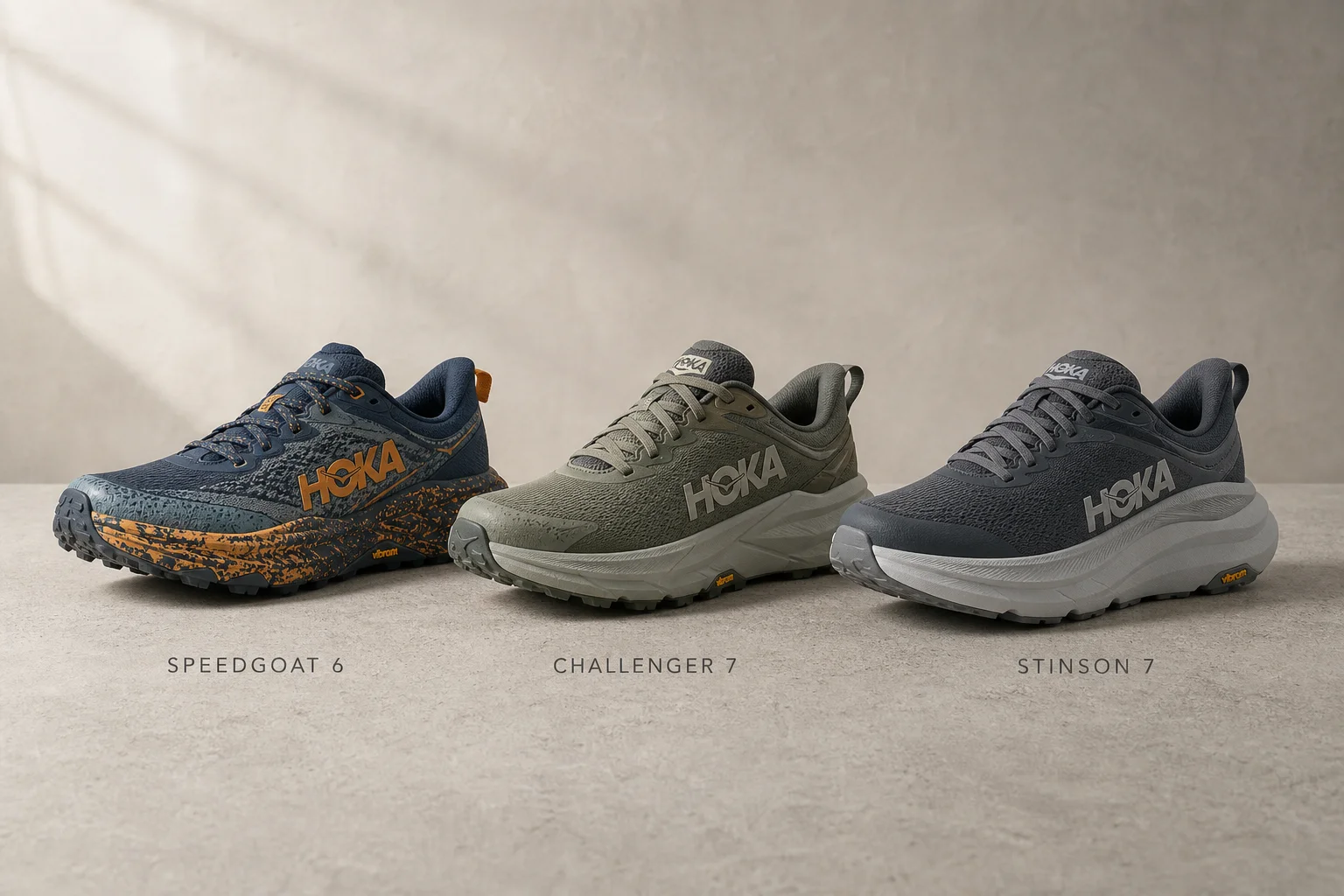 Three Hoka trail shoes displayed on concrete: Speedgoat 6, Challenger 7, and Stinson 7