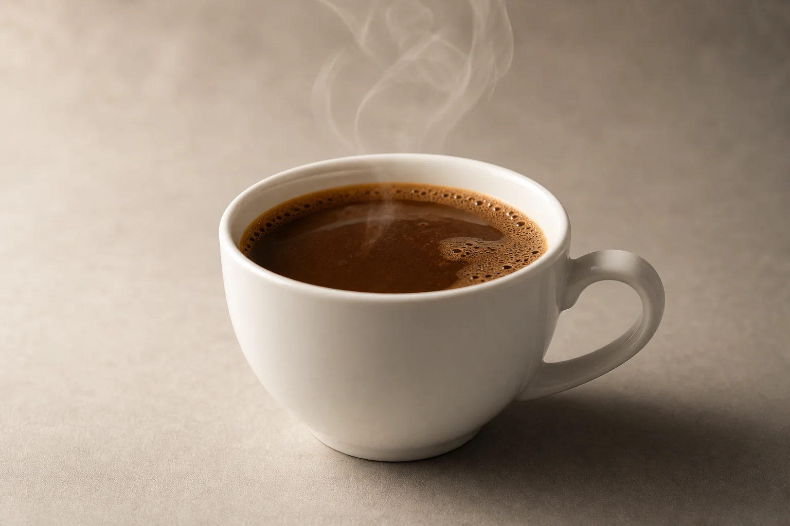 A single cup of instant coffee with rich brown color and subtle steam rising from the surface