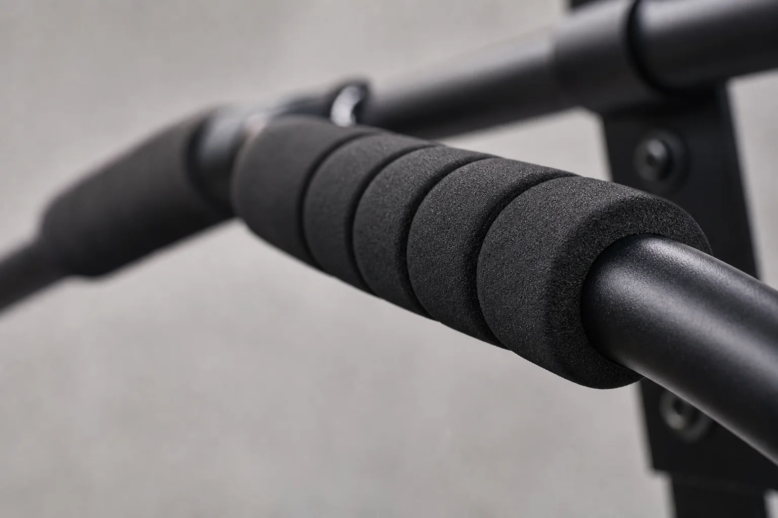 Close-up of foam grip padding on a pull up bar