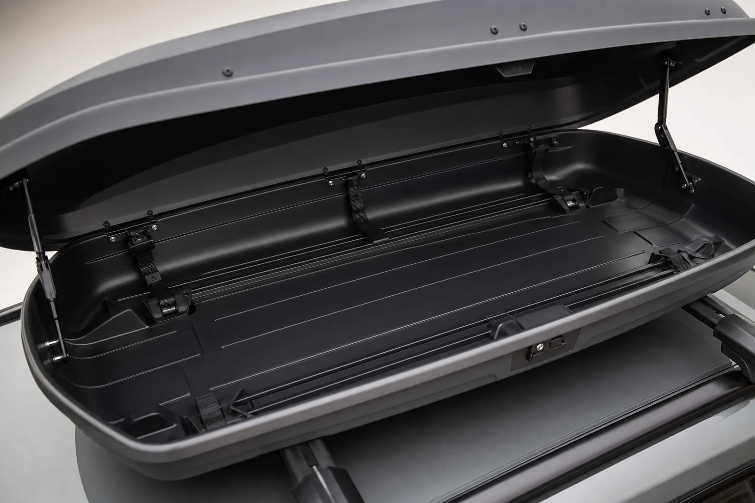 Interior view of open rooftop cargo box showing storage space