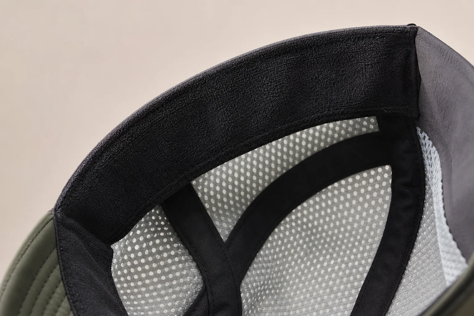 Close-up detail of a running cap's sweat band and interior construction