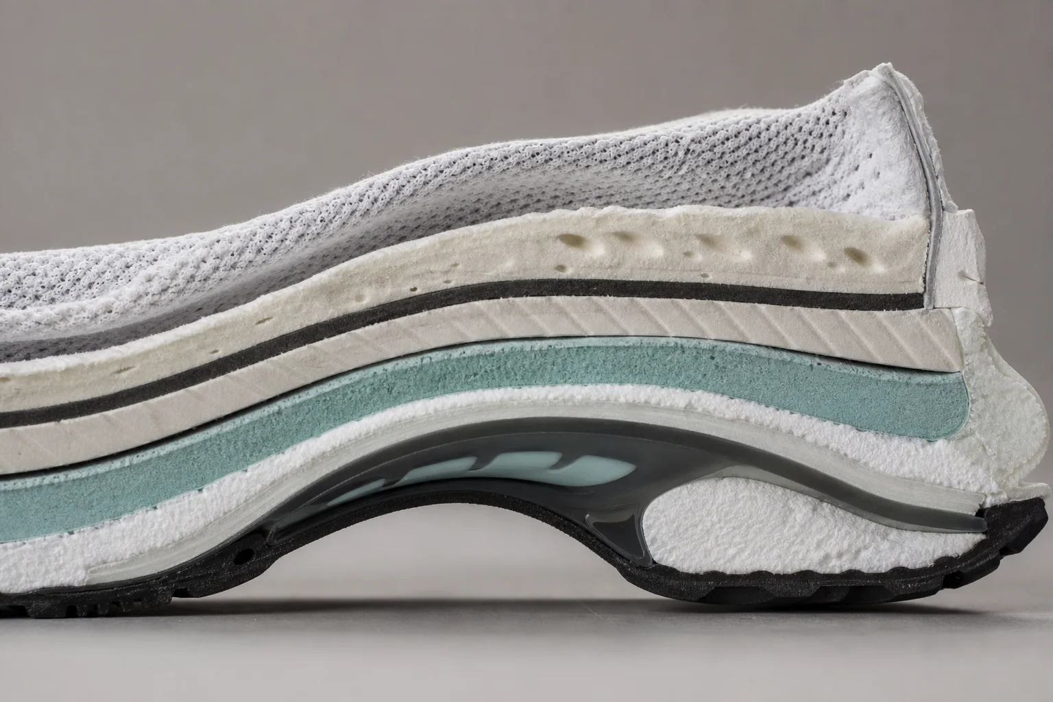 Close-up detail of shoe midsole showing cushioning layers and arch support