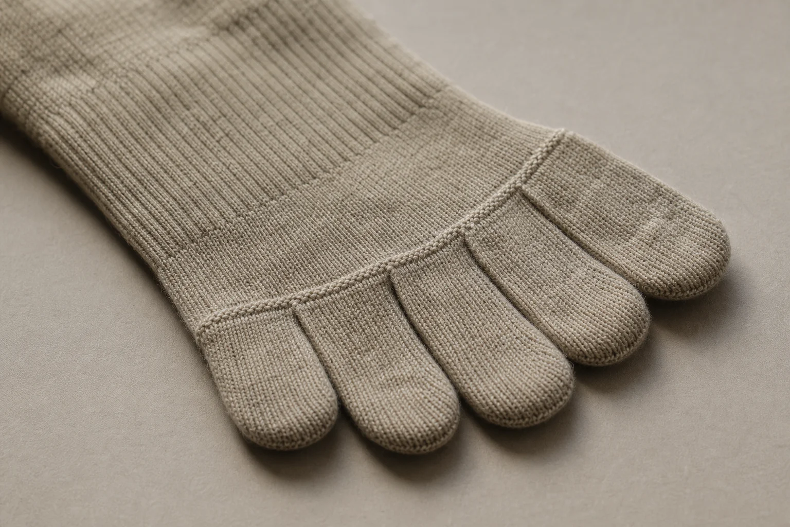 Toe sock detail showing individual toe compartments and merino wool texture