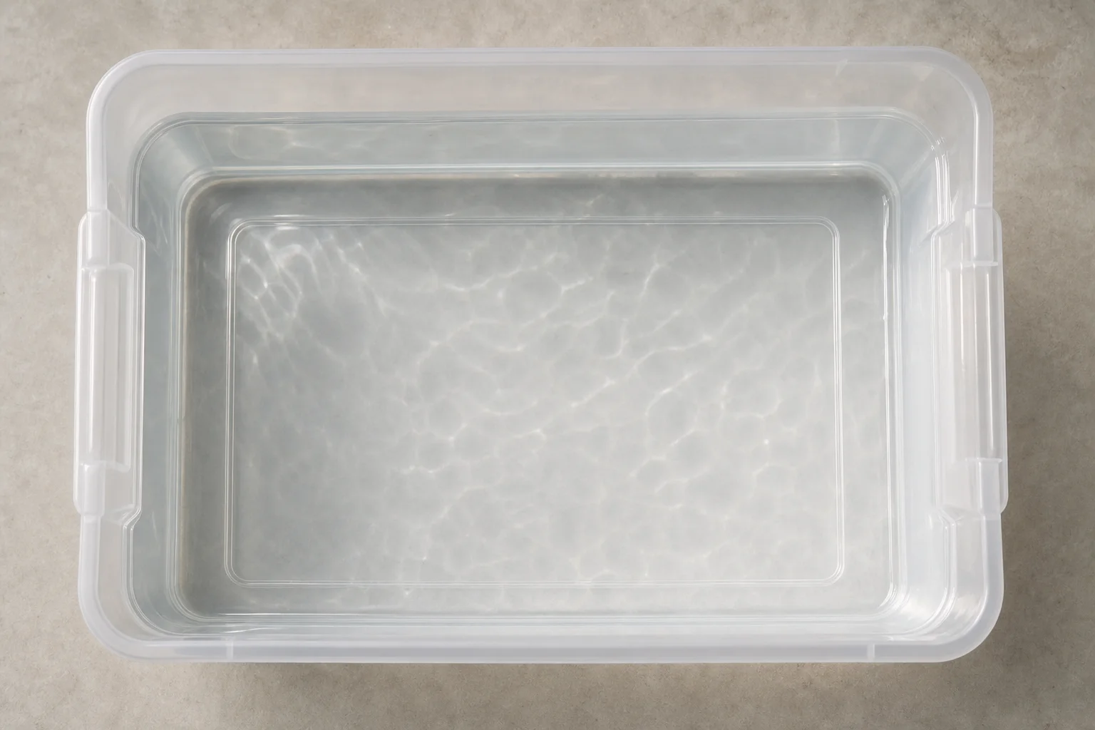 Clean mixing bin with transparent saltwater and no sediment