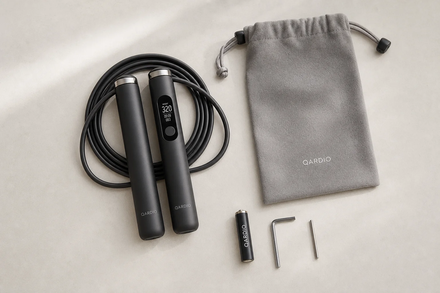 Smart jump rope with carrying pouch and accessories laid out on a surface