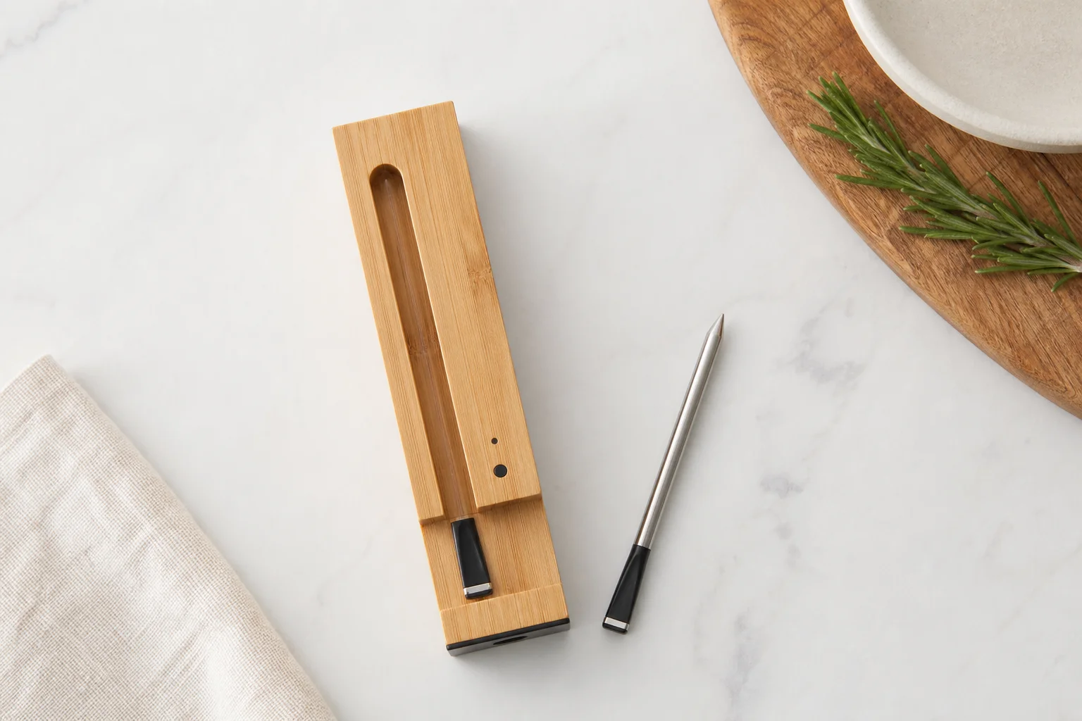 MEATER Plus probe and charging block on kitchen countertop