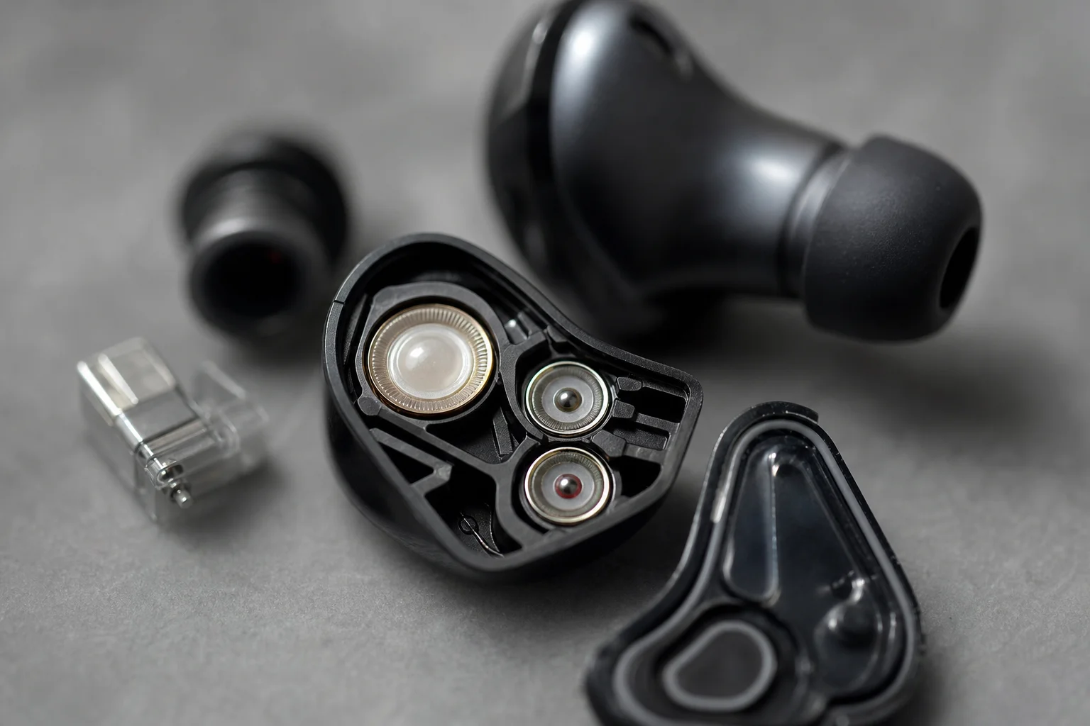 Close-up of earbud driver components showing internal acoustic design