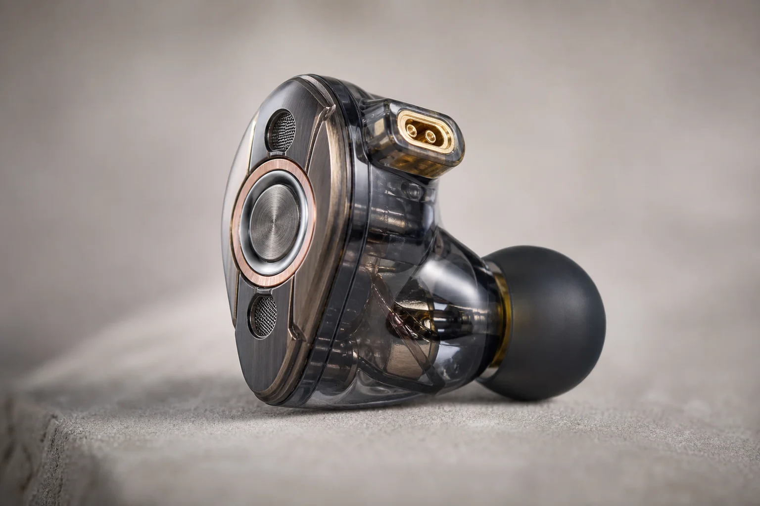 High-end earbud with multi-driver configuration in detail view