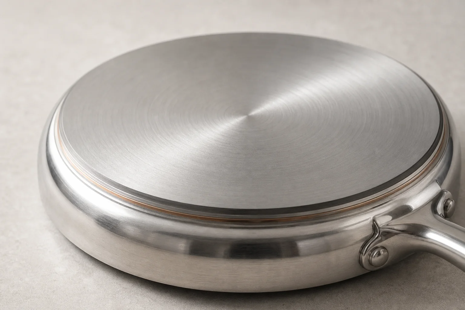 Close-up of stainless steel pan bottom showing flat surface and construction