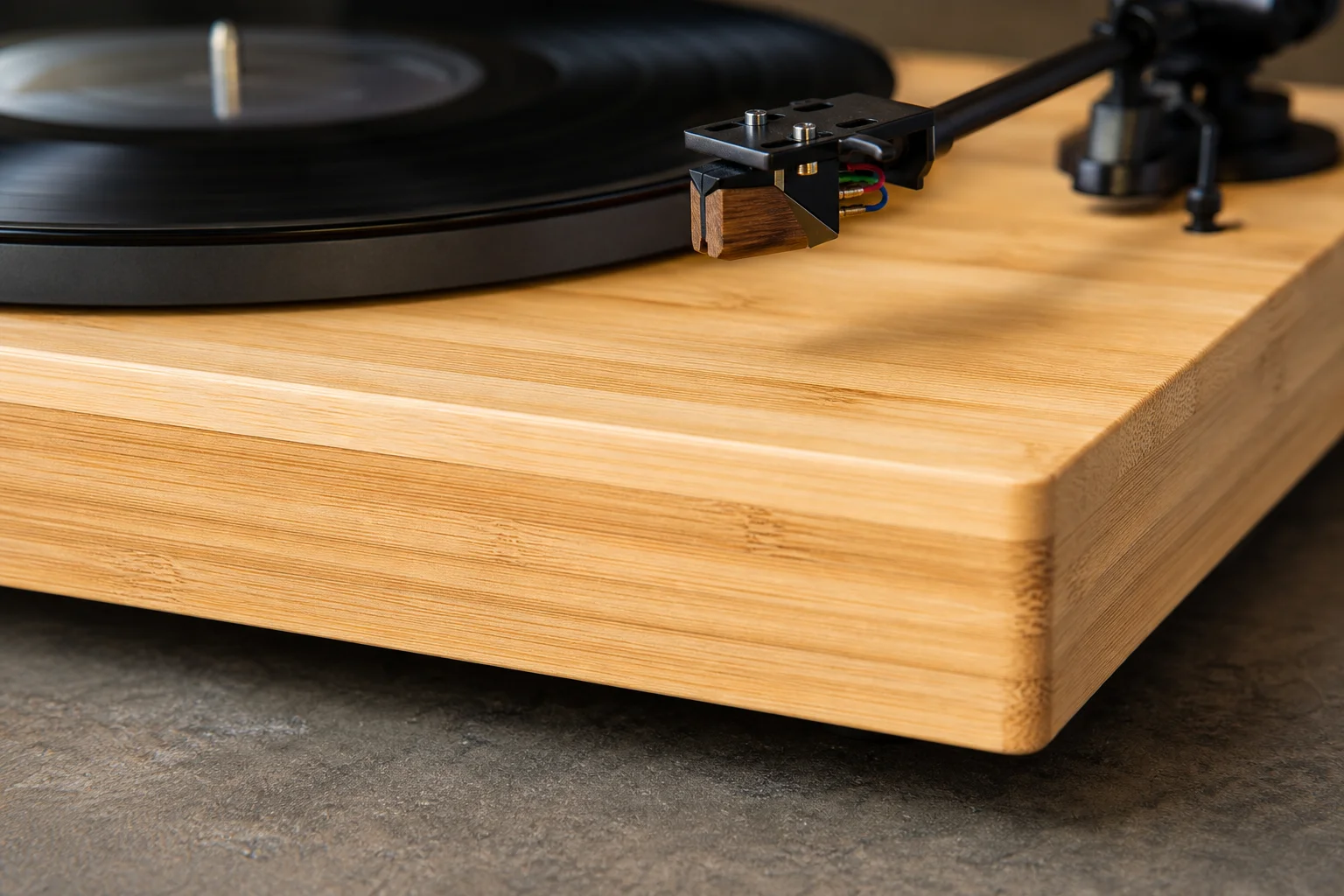 Close-up of bamboo plinth showing natural wood grain and texture