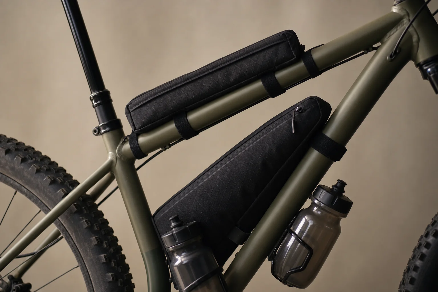 Top tube and seat tube bags mounted on hardtail frame with water bottles