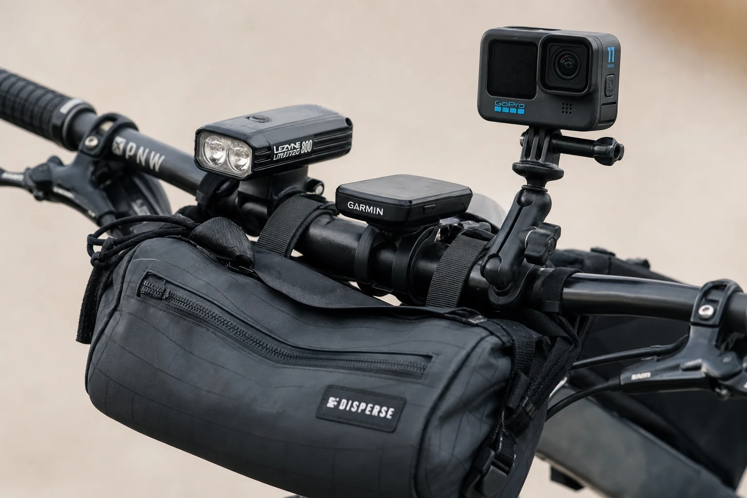 Close-up of handlebar bag and front-mounted gear on mountain bike